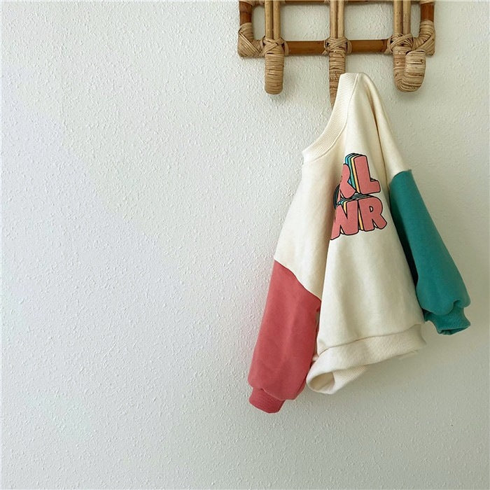 A fashionable baby and toddler style with color-blocking sleeves, letter-shaped sweatshirts and color-blocking pants with large pockets